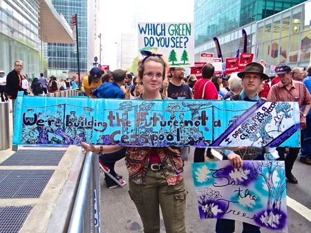 climate change marchers signs photos
