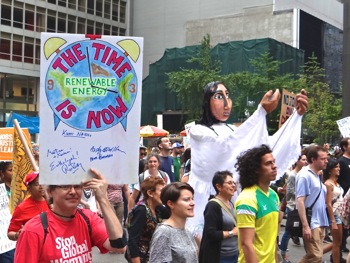 photos of UN climate change marchers signs