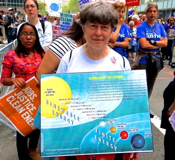 photos of climate change marchers signs